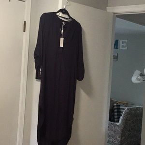 Never worn shirt style dress. Looks great loose or belted